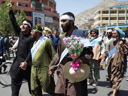 Dozens of men march for peace near Ghazni, on June 2018
