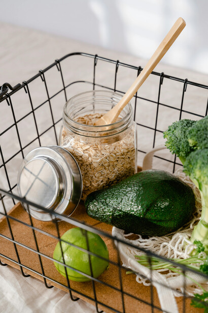 Green vegetables in a black basket, highlighting iron-rich plant foods, healthy superfoods, and natural supplements