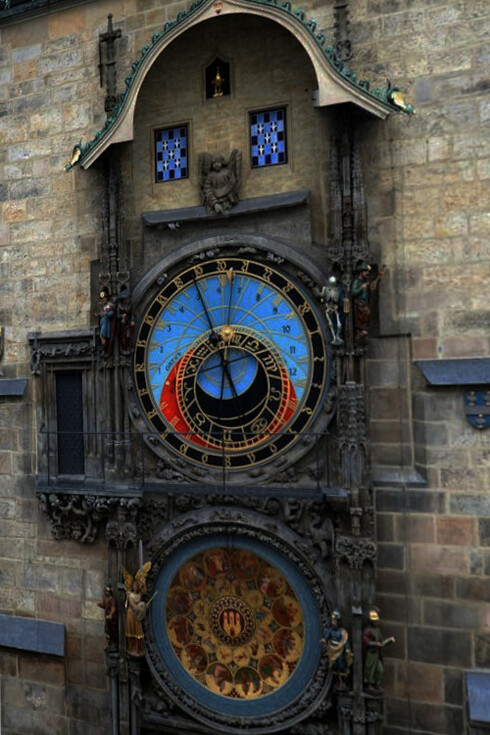 This stunning clock, found in Prague's Old Town Hall, features a celestial dial that tracks the sun, moon, and zodiac with intricate artistry, Czechia