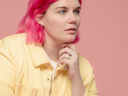 A woman in doubt and going through the stages of imposter syndrome