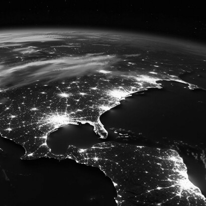 Electric veins of civilization trace the night-side globe, illustrating the living web of cooperation at the heart of evolutionary progress