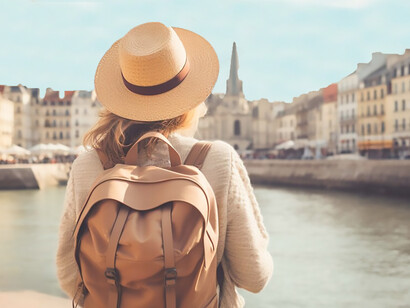 A chic traveler, sporting a backpack and trendy hat, explores diverse travel destinations and indulges in immersive cultural experiences
