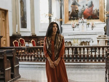 A woman walking through the church, symbolising the pursuit of a deeper relationship with God