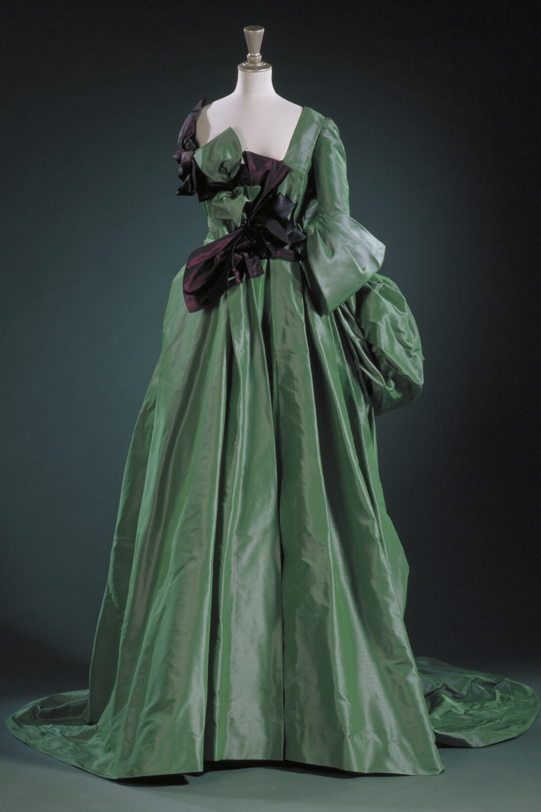 Shot silk and taffeta three-piece 'Watteau'evening gown including a skirt, corset and deerskin glove, designed by Vivienne Westwood, Great Britain, 1996 © Victoria and Albert