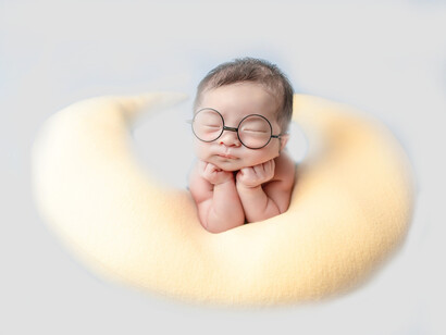 A baby falls asleep on a pillow to hold them up; make sure they are sleeping without too many distractions and have good sleep hygiene overall