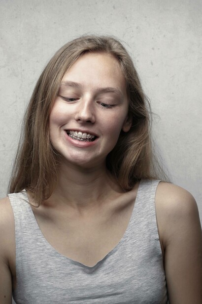 Young girl shows her braces