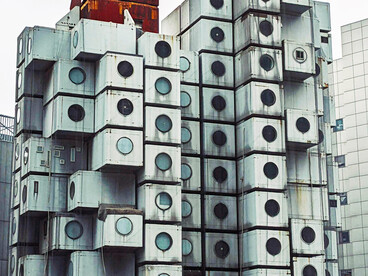 Exterior view of the Nakagin Capsule Tower, a modular capsule apartment building in Tokyo, Japan
