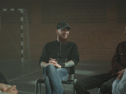 Men engage in a dialogue on the impact of male privilege and its implications in fostering a culture where sexual misconduct often goes unchecked, striving towards a more equitable society