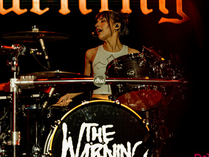 With focused intensity, Paulina from The Warning demonstrates her award-winning drumming technique, driving the band’s explosive sound forward, pictured here at their performance at the Magazzini Generali venue in Milan, Italy, on the 11th of April, 2024