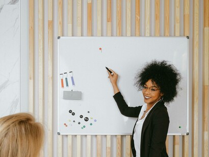 A woman teaching a student to earn income overseas