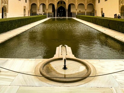 Tourists walk around the Alhambra, Granada, Spain