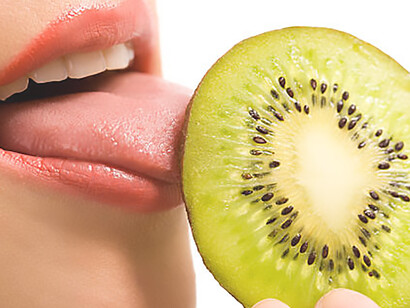 Experience the delight of a woman tasting kiwi, highlighting taste buds, taste receptors, and sweet treats  