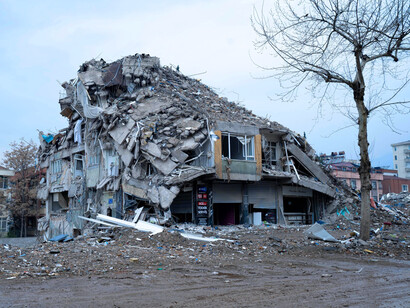 Shattered concrete and fallen walls, representing the fragility of structures once thought unbreakable