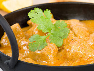 Korma is a traditional dish prepared by slowly cooking meat or vegetables with yogurt, stock, and aromatic spices, resulting in a creamy, flavorful gravy
