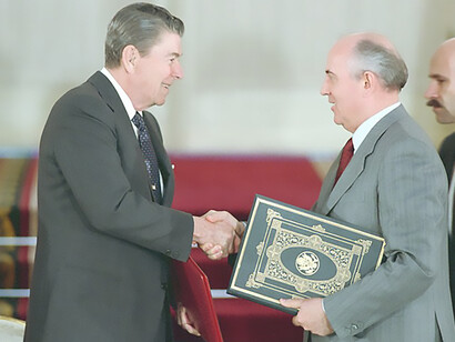 Reagan shakes hands with Gorbachev at INF Treaty signing, January 6, 1988