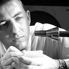 A researcher inspects a Gemini spacecraft mounted on a sting in the 11-Inch Hypersonic Tunnel in 1962. Courtesy NASA Langley Research Center