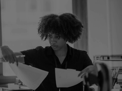 Comparisons being made by a woman in her studio workspace and viewing them from different angles