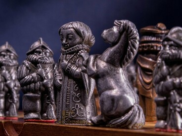 A royal chess piece standing at the centre of the board, representing the lasting rituals of institutional authority