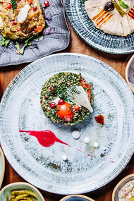 The table is adorned with a stunning display of Turkish appetizers, creating an authentic visual feast that captures the essence of the cuisine