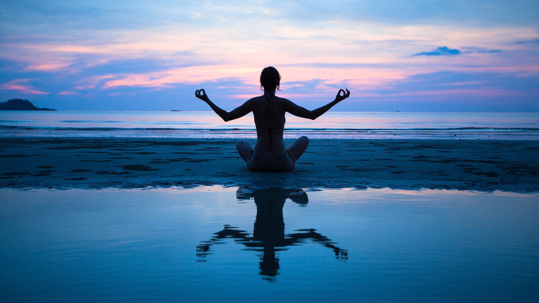 Meditating at sunset