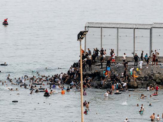 An estimated 60,000 people crossed from Morocco into Ceuta, overwhelming local authorities and triggering a humanitarian and border security crisis