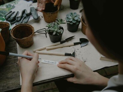 A writer jotting down a word that might be of inspiration