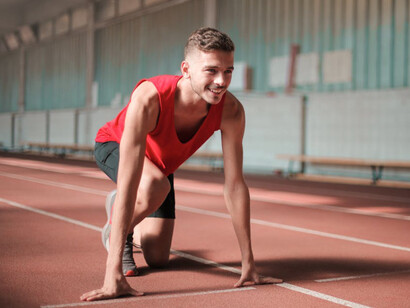 With determination etched on his face, this sprinter symbolises the hard work that fuels both athletic performance and the business of sports