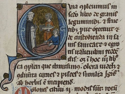 Frate domenicano assiste un malato