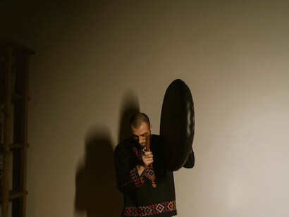 With each beat resonating in the darkened room, he finds a release that transcends words, expressing his deepest feelings through music