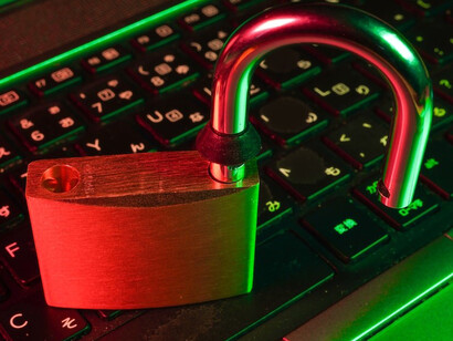 A vibrant padlock symbolizes robust cyber security as it sits atop a sleek black computer keyboard