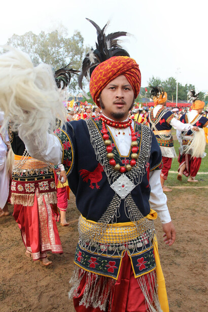 Members of the Khasi tribe dressed in traditional clothing performing in a cultural parade in Meghalaya, India