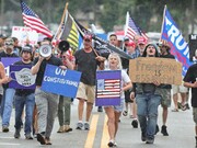 Demonstrators march against the wearing of face masks in downtown Sanford, Florida, where locals, like their pioneer forebears, have been resisting government orders © Joe Burbank/Orlando Sentinel/AP 