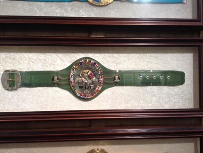 Ken Buchanan, title belt green close up