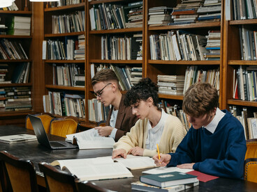 Students studying together in a library