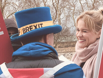 A man and woman, marched in London to voice their opposition against Brexit in the People's March, the UK