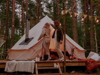As the sun sets behind the trees, the man and woman move in harmony, reminding each other that love, understanding, and healing are vital in navigating their emotional journeys