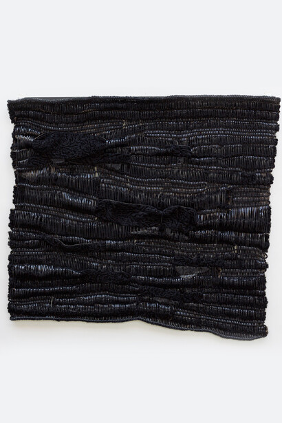 Luam Melake, Black 2017, Vinyl, Persian lamb fur, cotton drawstring cord, asphalt, 71 x 80 cm. Courtesy of the Artist and Addis Fine Art