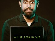 Man with a laptop suggesting that 'you have been hacked'