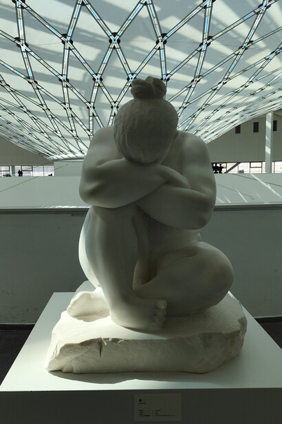 Her body shows every fold and contour without idealization