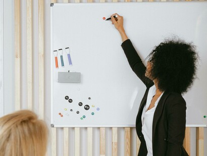 A woman teaching a student ESL to make a living while overseas