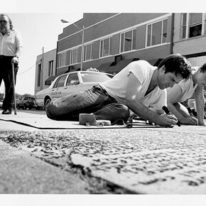 Kate Ericson and Mel Ziegler working on the public art project Loaded Text in Durham, North Carolina, 1989
