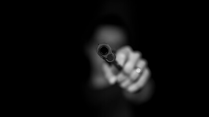 A gun pointed at the observer-violence begets violence