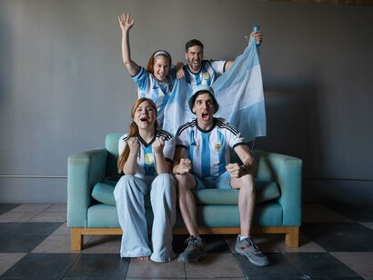 Argentine fans watching the game with unrestrained excitement, reflecting the thin line between triumph and disappointment