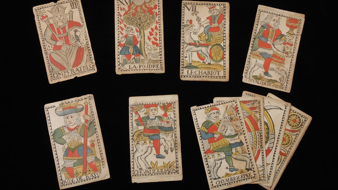 Twelve cards from a tarot deck with French text