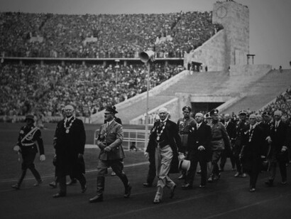 Adolf Hitler enters the 1936 Berlin Olympic Stadium with IOC President Count Henri de Baillet-Latour and Theodor Lewald before the Opening Ceremony