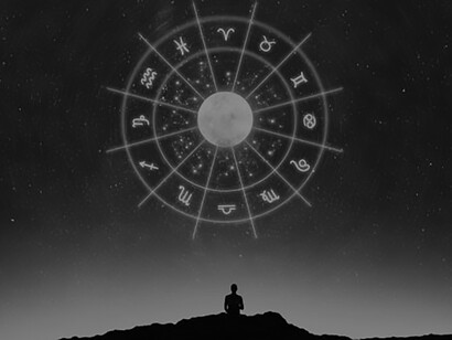 Experience the mystique of the astrological wheel projection with an enchanting image of a man seated beneath a starry night, capturing the essence of celestial wonder and cosmic alignment