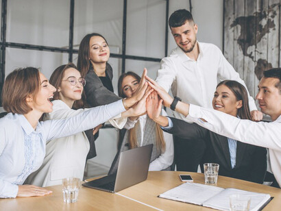 A collaborative team crafting a successful business plan in an office environment, exuding joy, teamwork, and inspiration