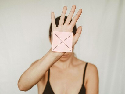 No communication, a woman holds a stop signal