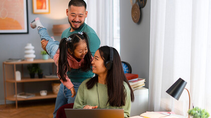 A mother taking a mindful break from work to watch her her family and engage with them, representing the importance of being present in small moments