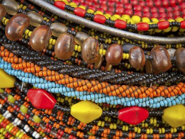 A close-up of richly coloured beads, representing how patterns indicate cultural roots